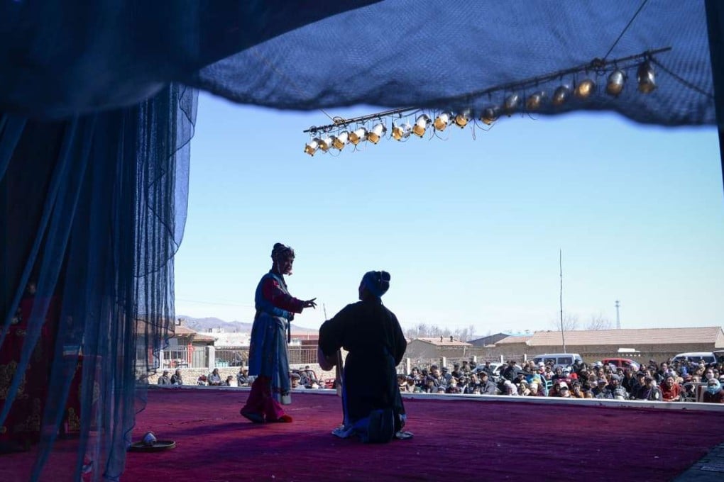 Two Jin opera performers on stage at an outdoor theatre in Yu county in Hebei province. Photo: AFP