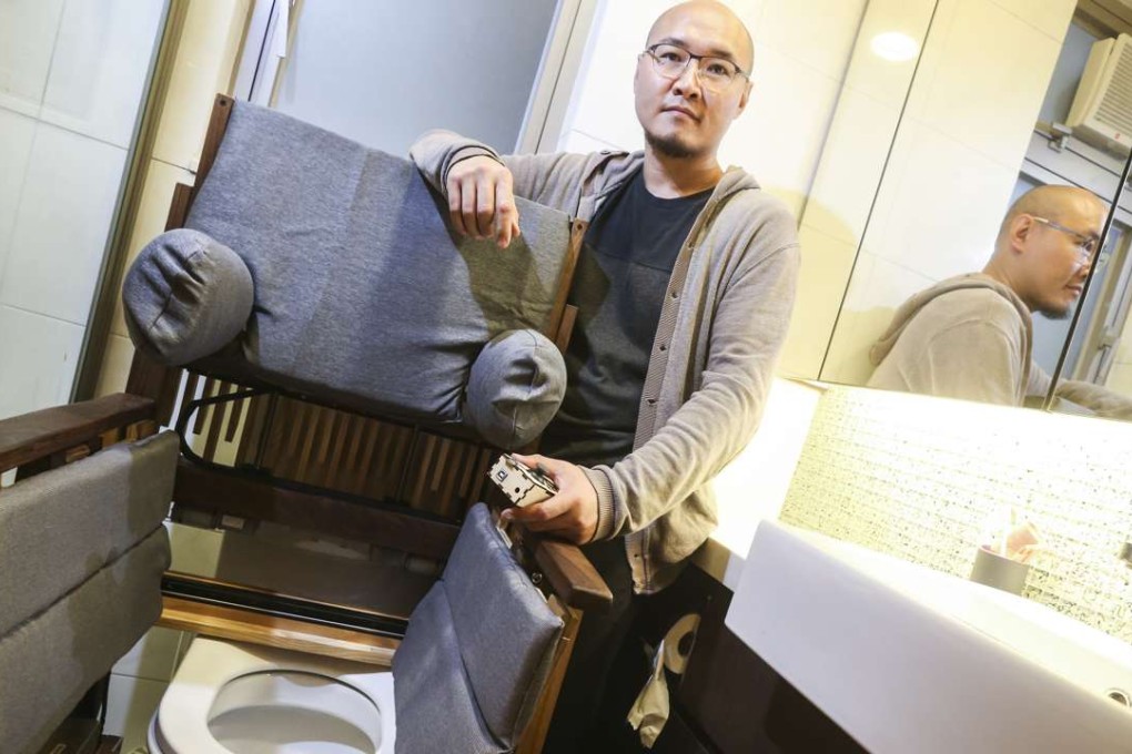 Chun Kwok-tung with the wheelchair he designed at his home in Tsing Yi.Photo: K.Y. Cheng