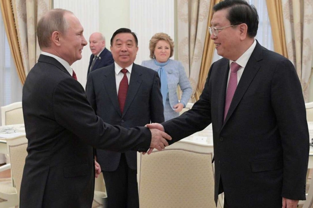 Russian President Vladimir Putin shakes hands with Zhang Dejiang, chairman of China’s National People’s Congress, at a meeting at the Kremlin in Moscow on April 19. Relations between China and Russia have steadily improved after the collapse of the Soviet Union. Photo: Kremlin via Reuters