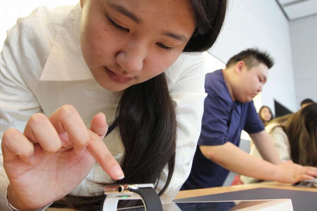 Young, free-spending Chinese singletons are turning their backs on married life for the sake of fun lifestyles, and are happily spending their hard-earned cash on luxury items such as Apple Watches, seen here at the Apple Store in Beijing. Photo: Simon Song