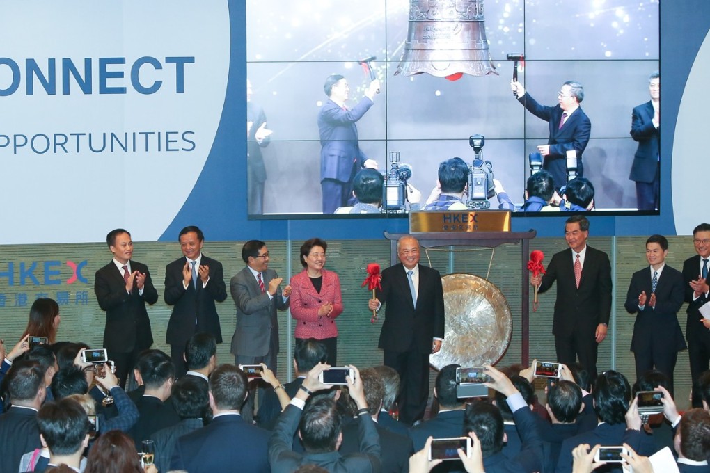 (From left to right) Executive Vice President of the Shanghai Stock Exchange, Que Bo; HKEX Chief Executive Charles Li Xiaojia; Chairman of the Securities and Futures Commission, Carlson Tong Ka-shing; Deputy Director of the Liaison Office of the Central People's Government in HKSAR, Qiu Hong; HKEX Chairman Chow Chung-kong, Chief Executive of Hong Kong, Leung Chun-ying, Vice Chairman of the China Securities Regulatory Commission, Fang Xinghai, Secretary for Financial Services and the Treasury, Professor Ceajer Chan Ka-keung; and Chief Executive of the Hong Kong Monetary Authority, Norman Chan Tak-lam; attend the Launch Ceremony of Shenzhen-Hong Kong Stock Connect at Exchange Square in Central. 05DEC16 SCMP/ K. Y. Cheng