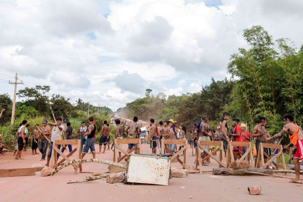 Indigenous people of the Munduruku tribe block the Transamazon Highway near Itaituba, Para State, north of Brazil, on Sunday.The action was part of a nationwide strike and other action by indigenous communities. Photo: AFP