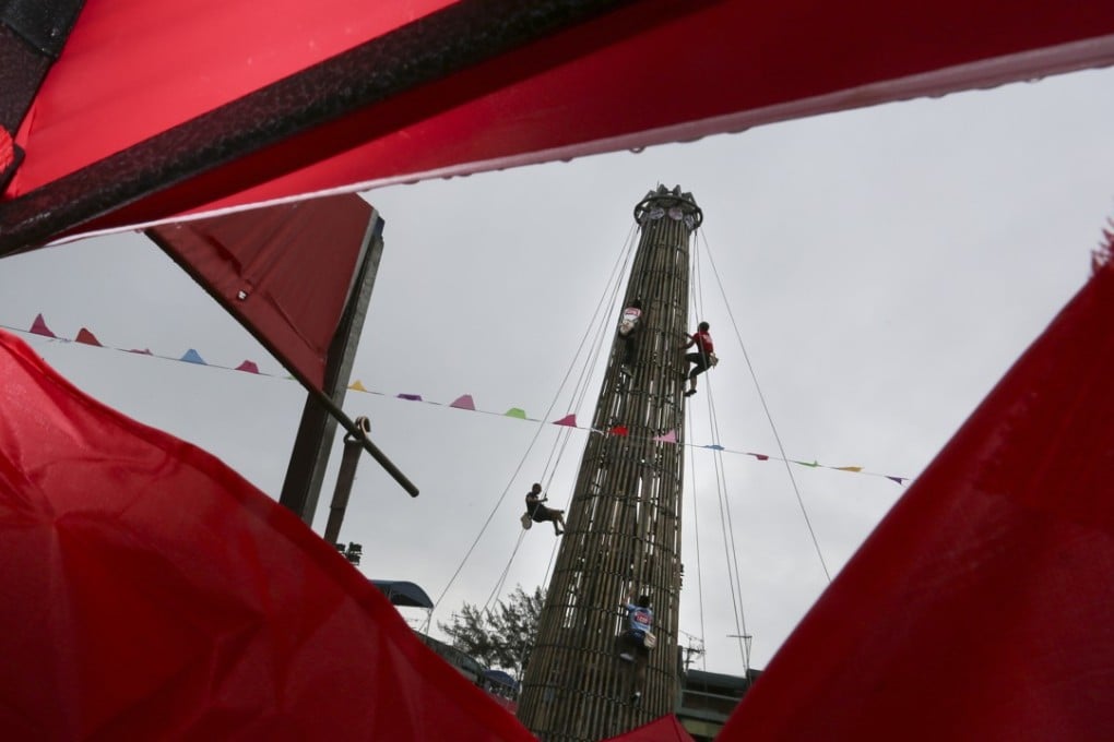 Participants compete at the Cheung Chau Bun Festival Climbing Carnival. Photo: Jonathan Wong