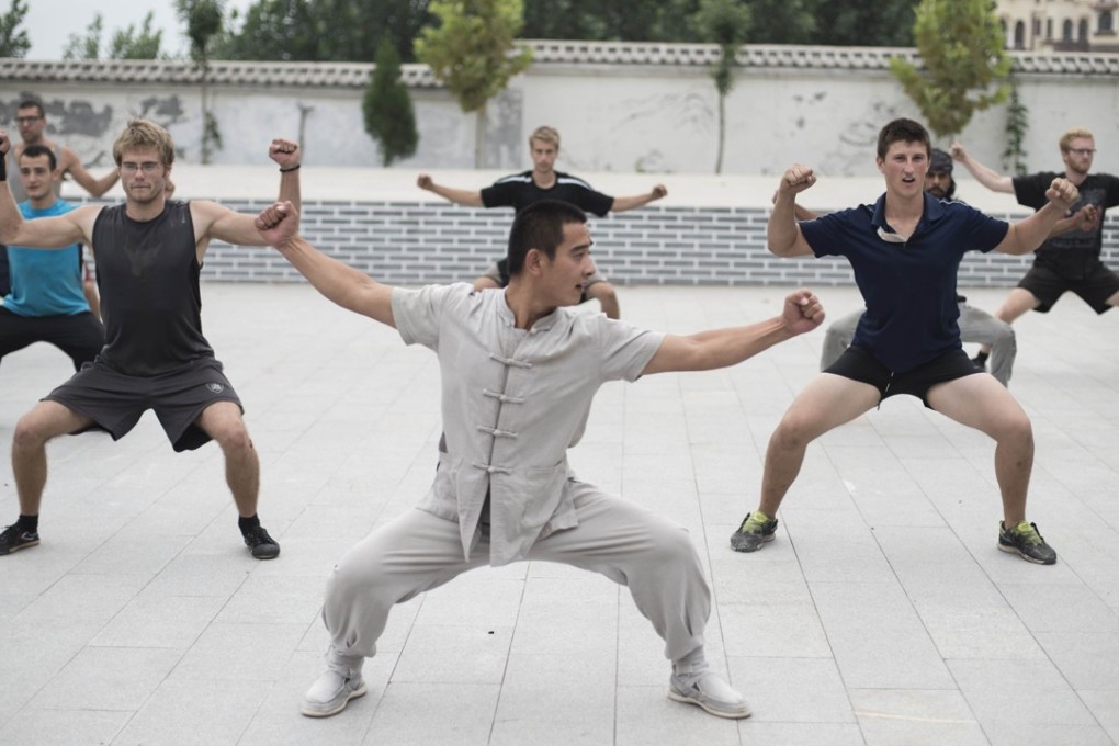 A Chinese kung fu master trains with his students at an academy in Qufu, Shandong province. Photo: AFP