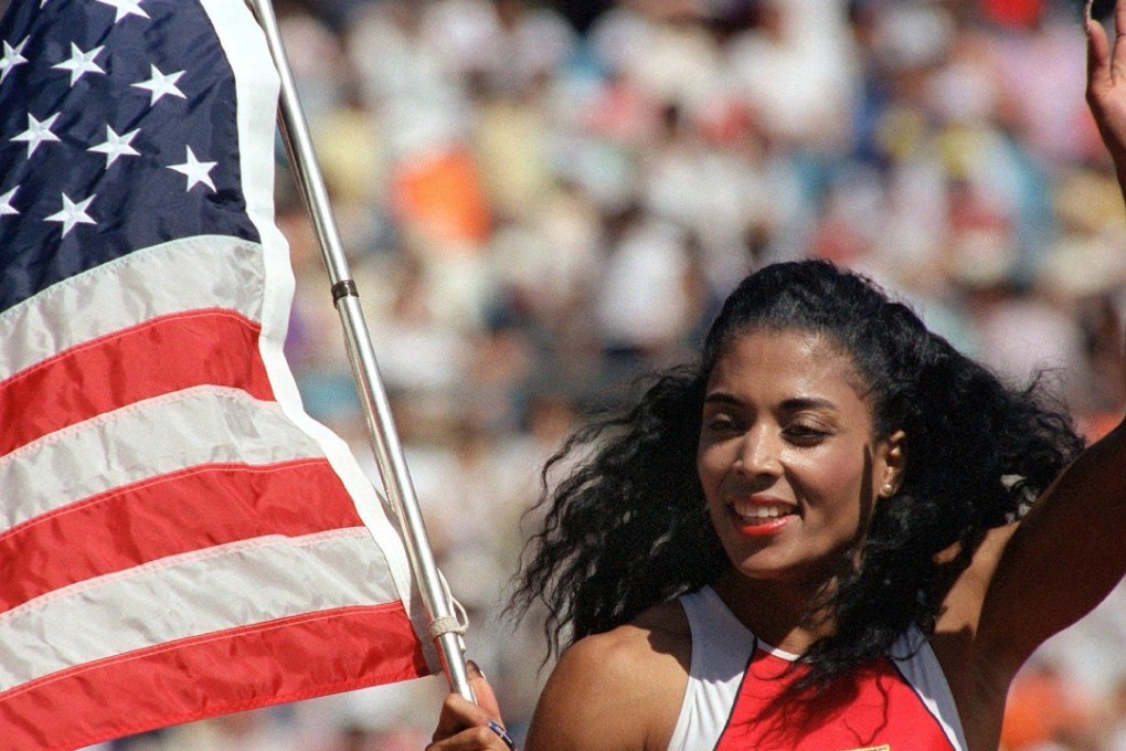 US sprinter Florence Griffith Joyner waves the US flag after winning the 100 metre final at the 1988 Olympic Games. Photo: AFP