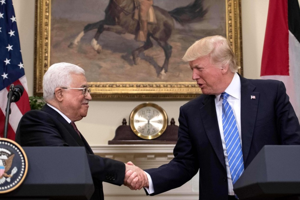 US President Donald Trump and Palestinian Authority President Mahmud Abbas shake hands at the White House in Washington, where the US leader expressed optimism a peace deal will be reached between Israel and the Palestinians. Photo: AFP