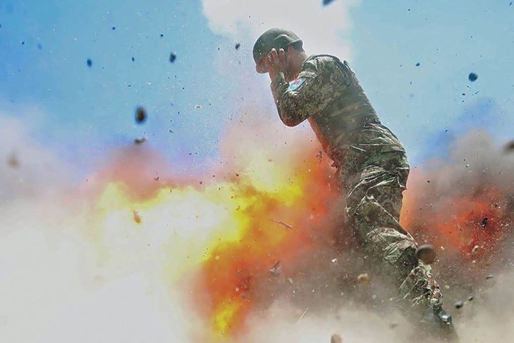 The final photo taken by US Army combat photographer Hilda Clayton shows an Afghan soldier as a mortar tube accidentally explodes in Laghman province, Afghanistan, on July 2, 2013. The blast killed Clayton and three Afghan soldiers. Photo: EPA
