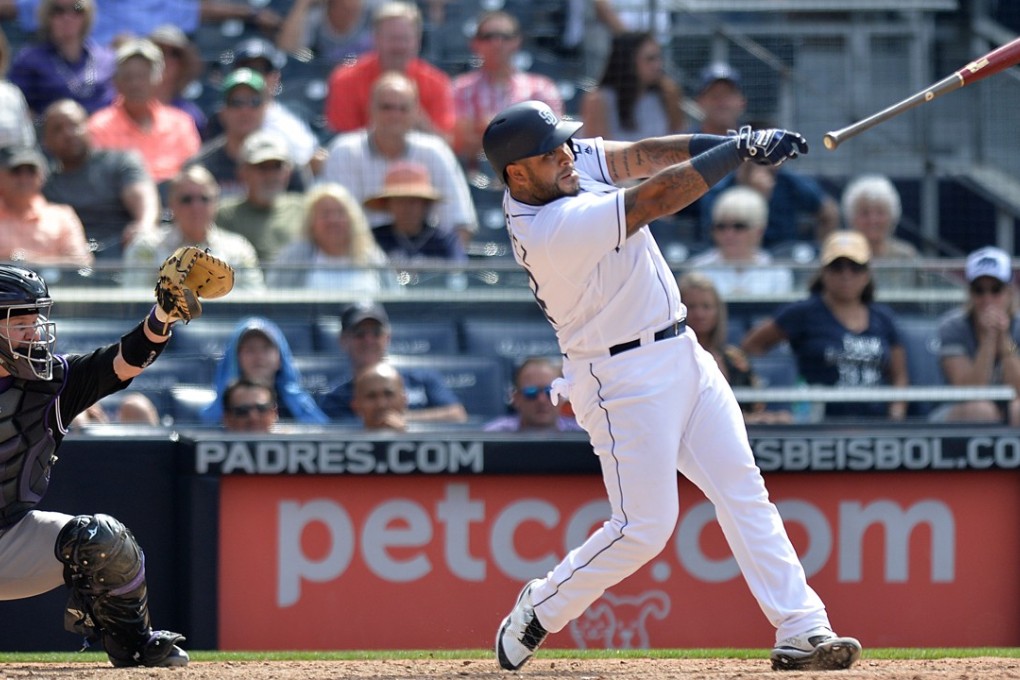 San Diego Padres’ Hector Sanchez loses the grip on his bat before it went into the stands and struck a fan in the head. Photo: USA Today