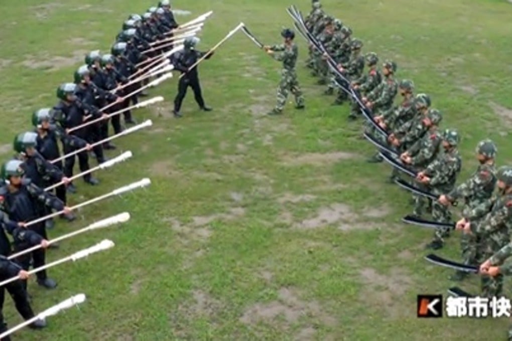 Police officers armed with Japanese bayonets and Chinese broadswords square off. Photo: Handout