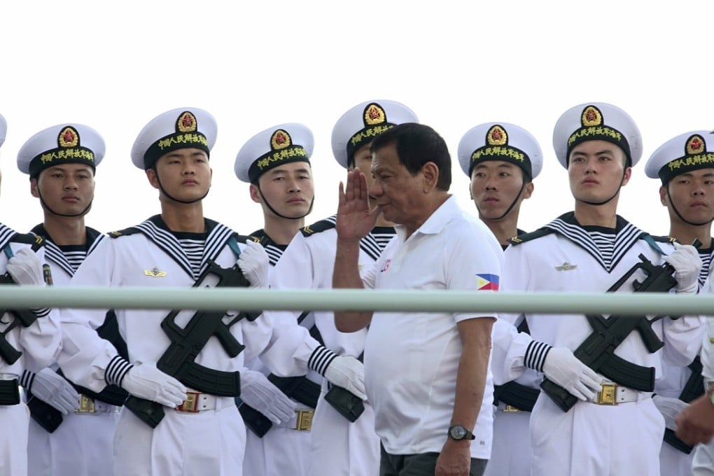 PLA Navy personnel are saluted by Philippines President Rodrigo Duterte as he tours a Chinese navy flotilla that docked in Davao City on a four-day goodwill visit, on May 1. Photo: EPA