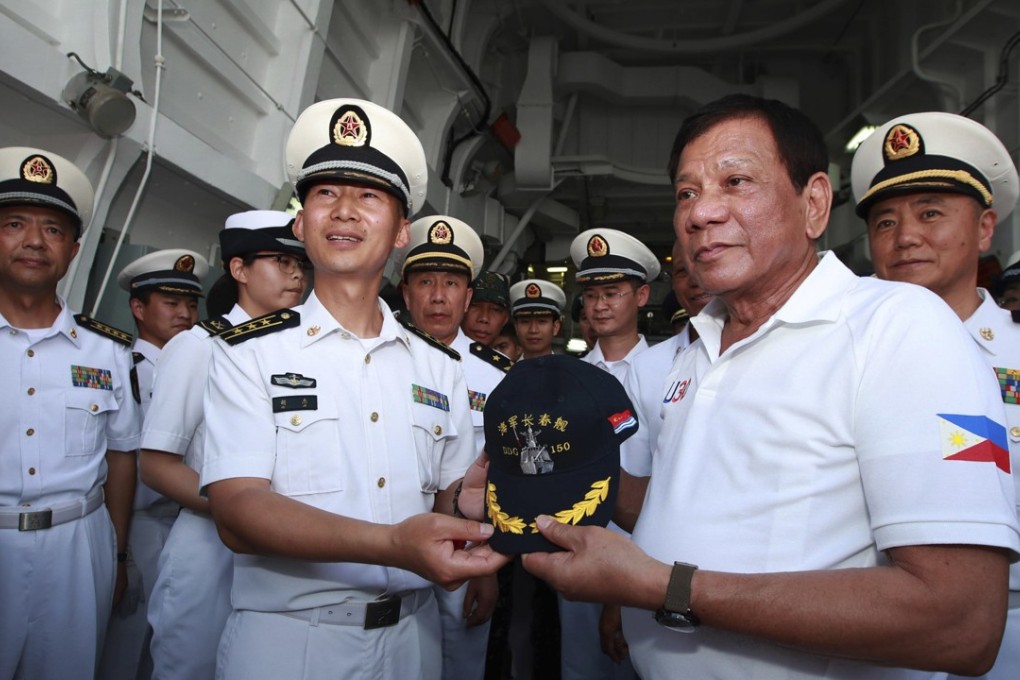 Philippine President Rodrigo Duterte (right) visits the Chinese navy missile destroyer Changchun in Davao City on May 1. Photo: Xinhua