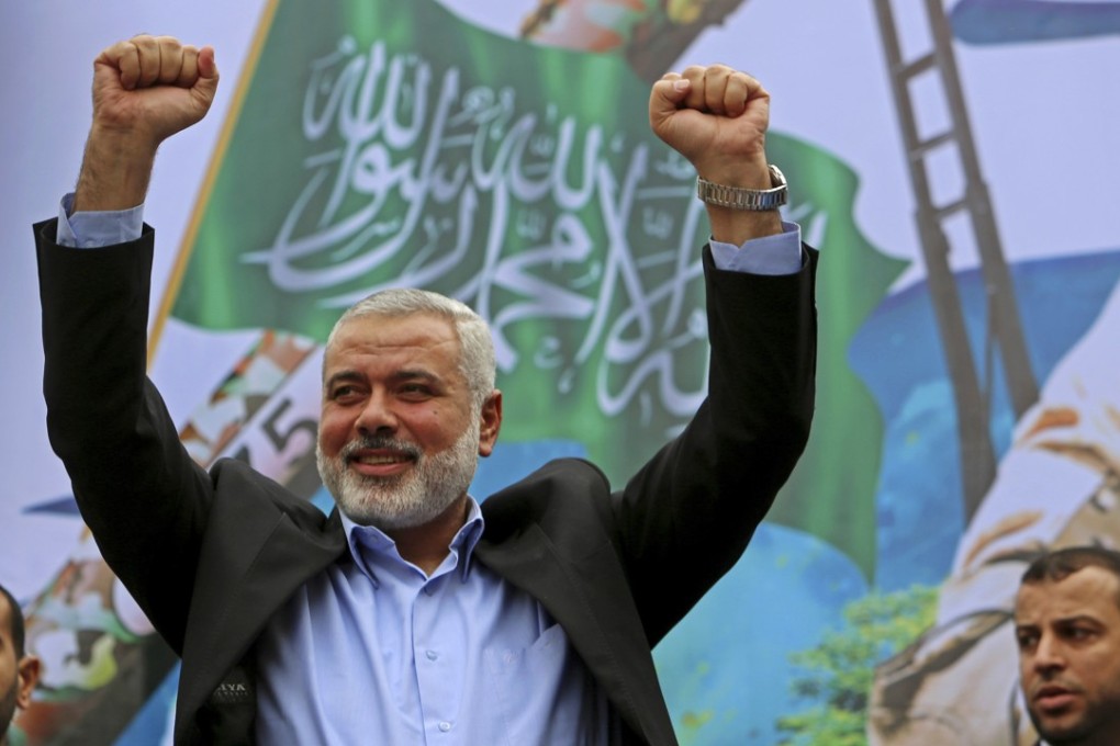File photo of Hamas leader Ismail Haniyeh greeting supporters at a rally to commemorate the 27th anniversary of the Hamas militant group in Jebaliya in the northern Gaza Strip. Photo: AP