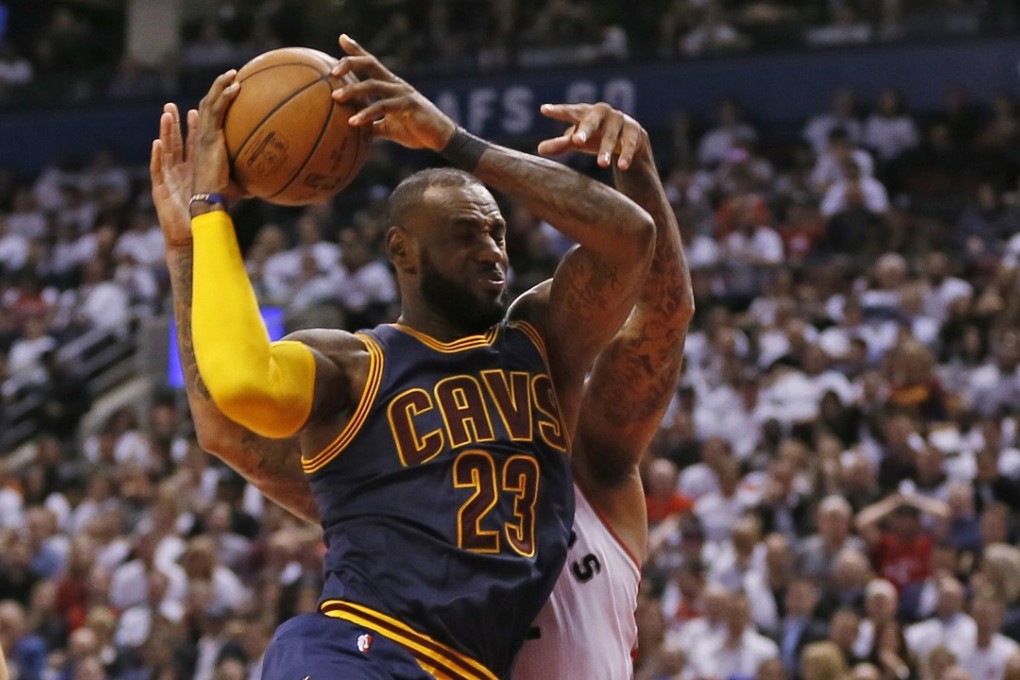 Cleveland Cavaliers forward LeBron James (23) comes down with a rebound against Toronto Raptors forward PJ Tucker (2) during game three of the second round of the 2017 NBA Playoffs at Air Canada Centre. Photo: John E. Sokolowski-USA TODAY Sports