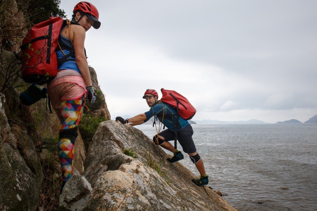 Esther Röling (left) and Paul Niel, on rocks near Chung Hom Kok Beach, have partnered with the Open University of Hong Kong to create the first full coastal pollution map of Hong Kong Island. Photos: Tessa Chan