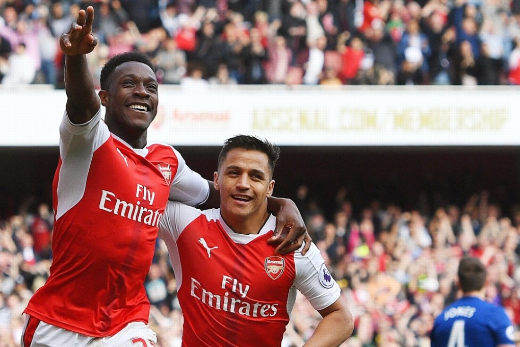 Arsenal’s Danny Welbeck celebrates with teammate Alexis Sanchez after scoring in the 2-0 win over former club Manchester United. Photo: EPA