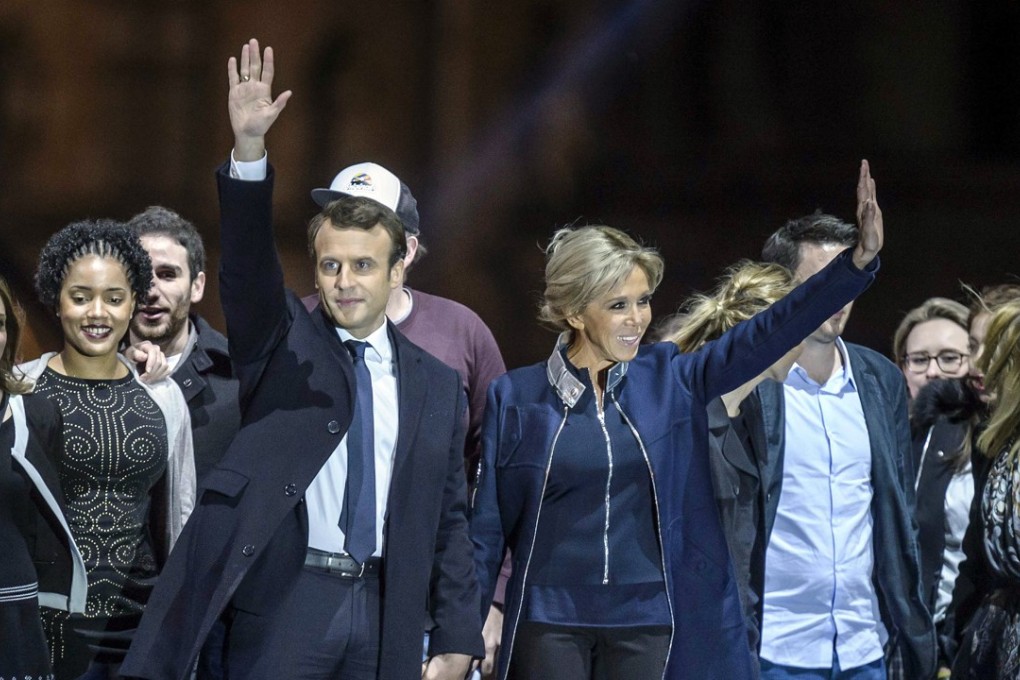 Emmanuel Macron and his wife Brigitte Trogneux celebrate his election victory. Photo: EPA