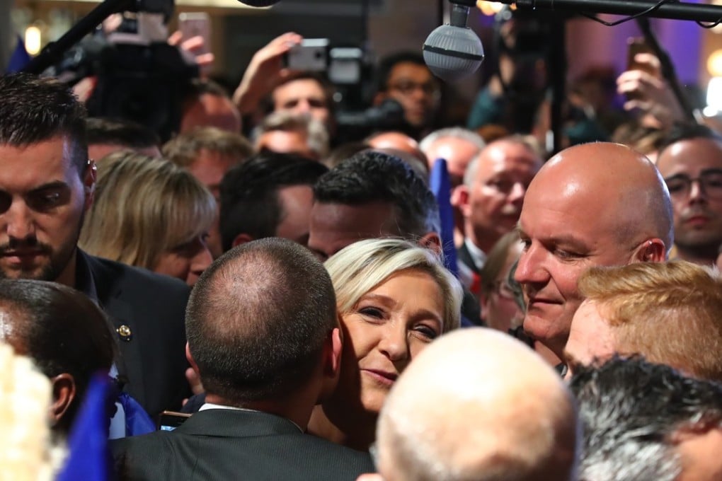 Defeated far-right presidential candidate Marine Le Pen greets supporters after giving her concession speech in Paris on Sunday. Photo: Xinhua