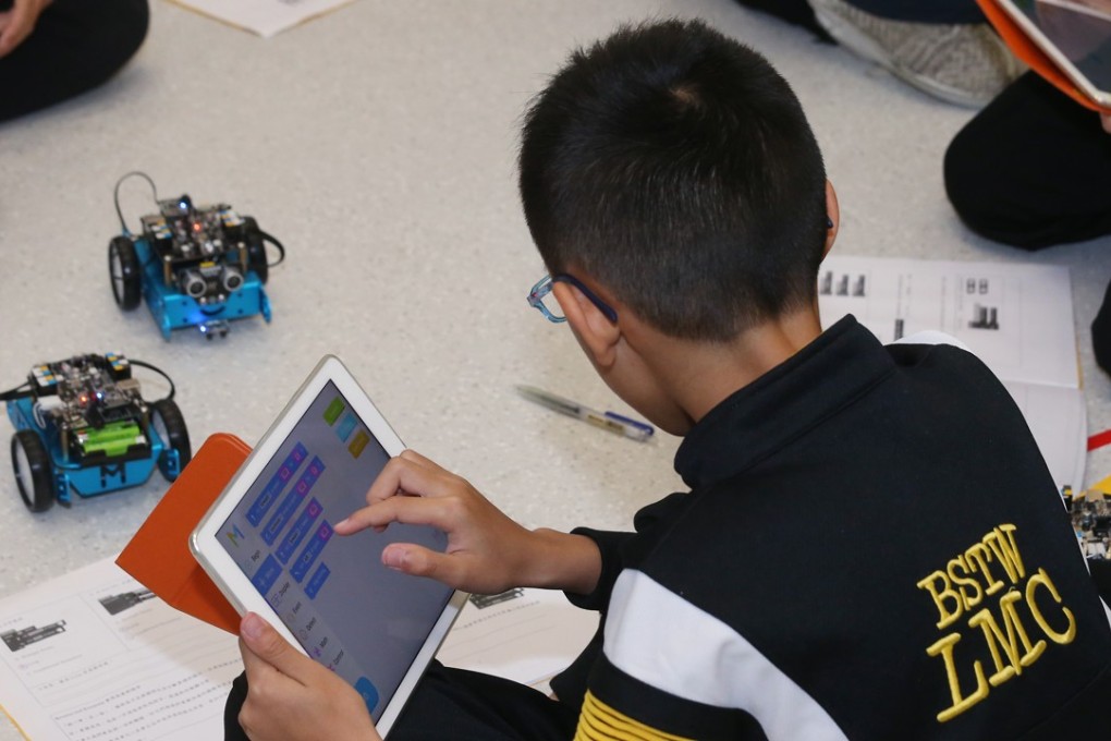 Students learn about robotics and STEM subjects at the Baptist Lui Ming Choi Primary School in Sha Tin. Educators could turn to computer programming to kindle youngsters’ passion for science. Photo: K. Y. Cheng