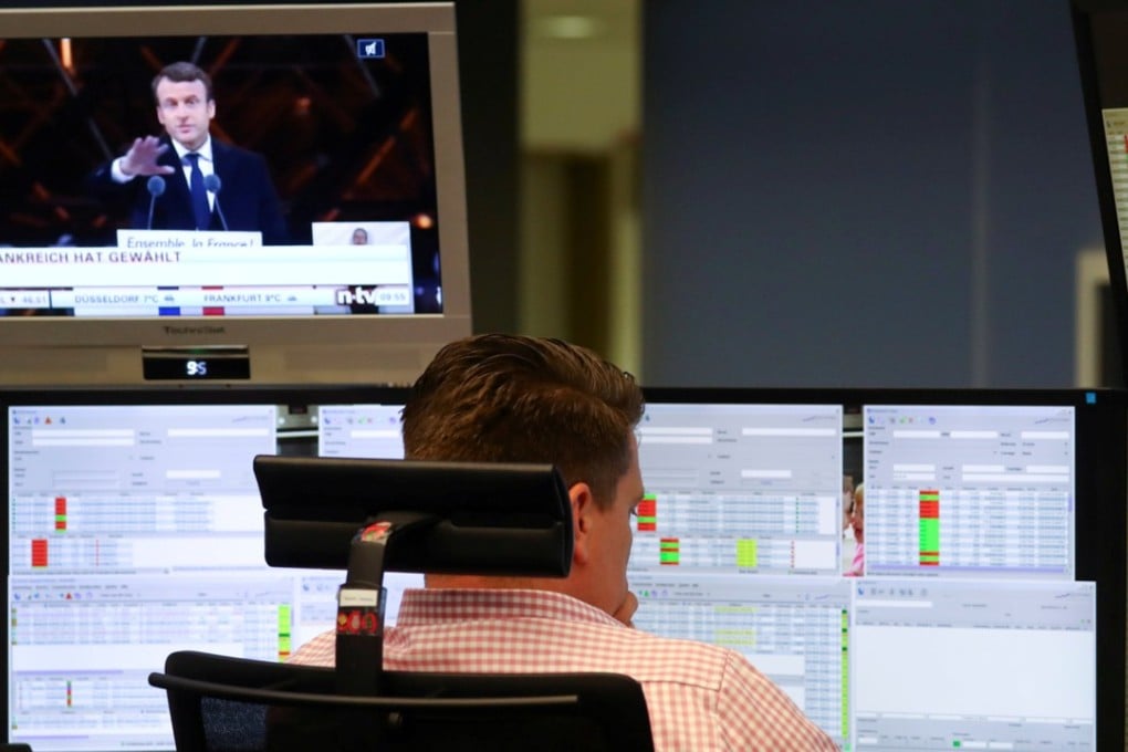 A trader works at the stock exchange in Frankfurt, Germany, on Monday as European equities held mostly steady after the victory of centrist Emmanuel Macron in French presidential polls. Photo: Reuters