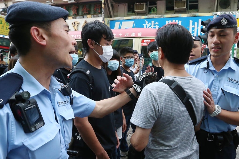 Police officers surround protesters during a protest against parallel traders in Sheung Shui. Photo: K. Y. Cheng