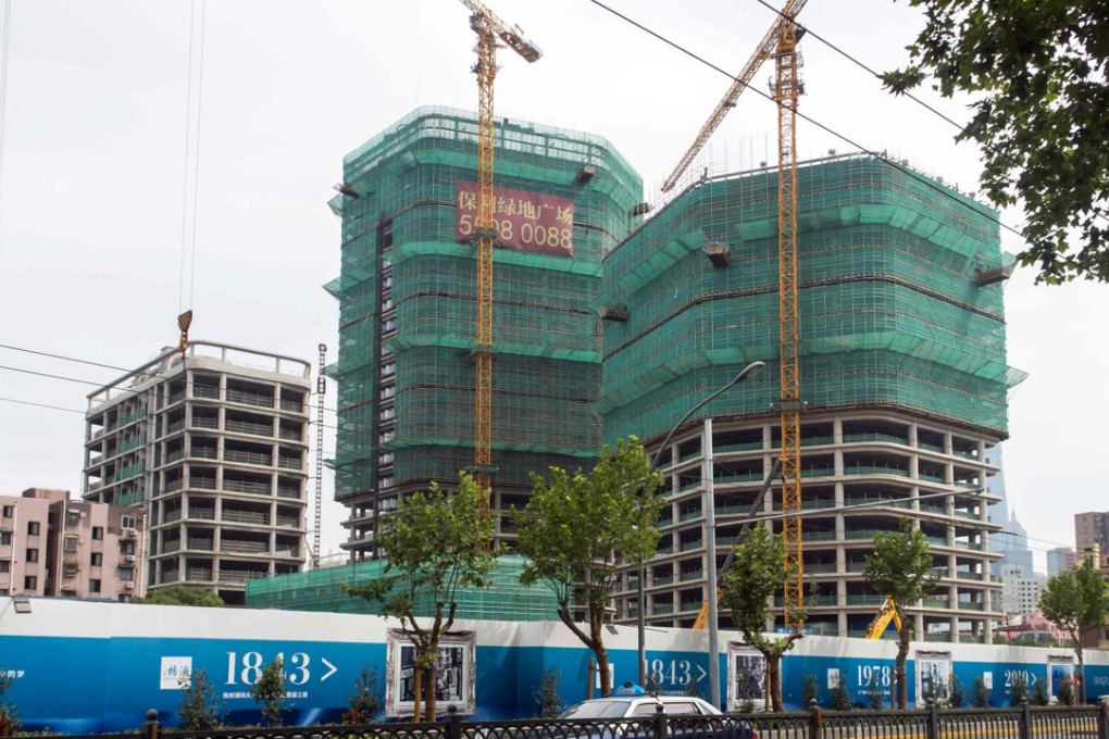 Shanghai’s local government has banned sales of residential units built on land designated for retail and office space. Photo: AFP