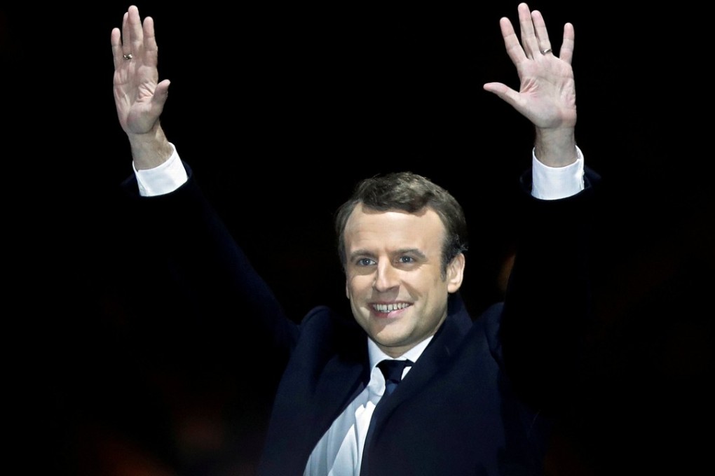 French President-elect Emmanuel Macron celebrates on the stage at his victory rally near the Louvre in Paris. Photo: Reuters