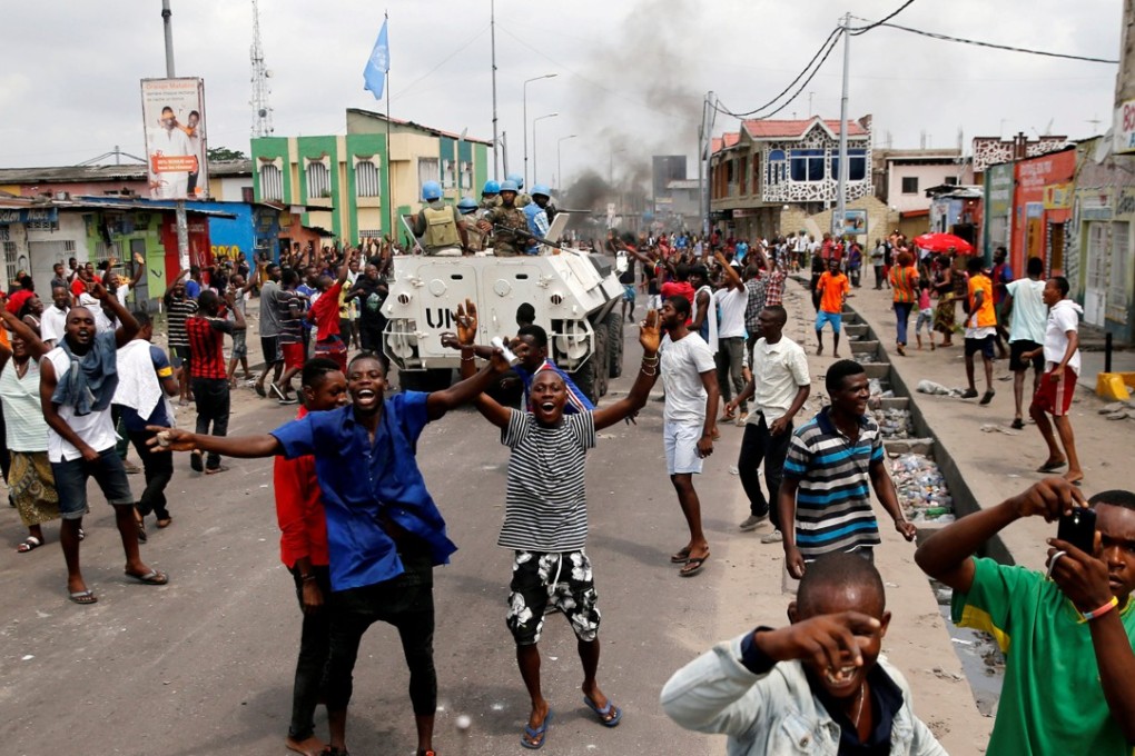Residents chant slogans as peacekeepers serving in the United Nations Organisation Stabilisation Mission in the Democratic Republic of the Congo (MONUSCO) patrol as ethnic violence in the country escalates. Photo: Reuters