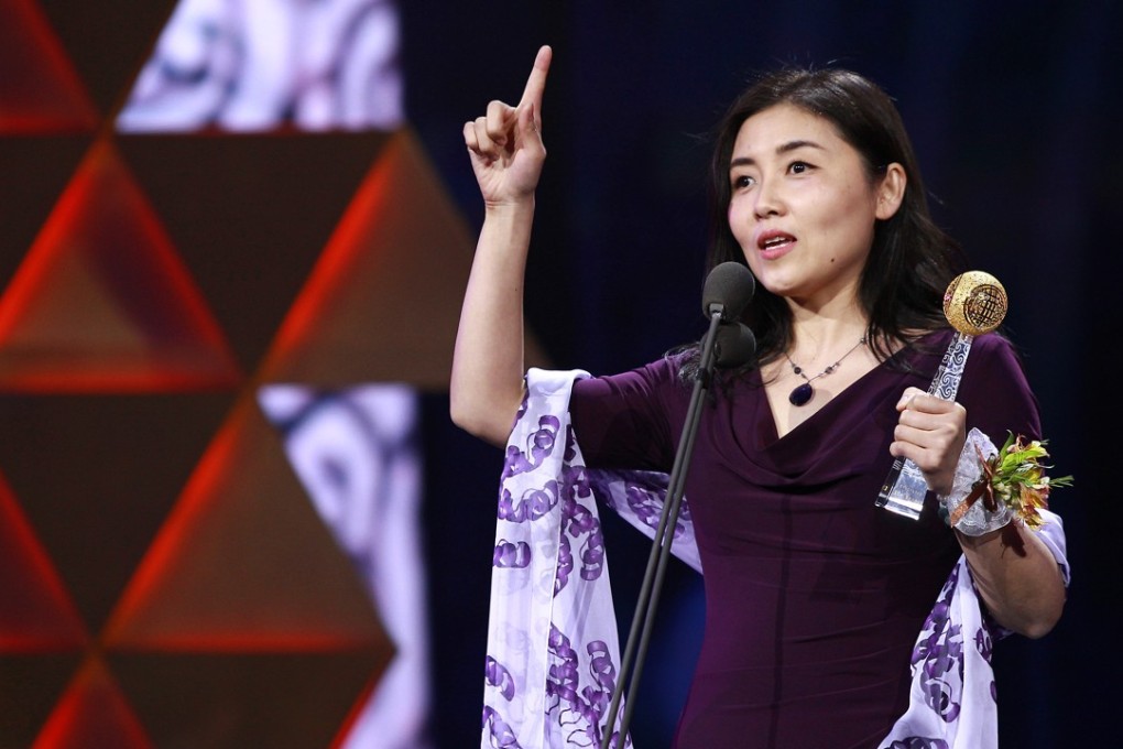 American-trained life scientist Nieng Yan receives an award in Beijing in March. Photo: Imaginechina