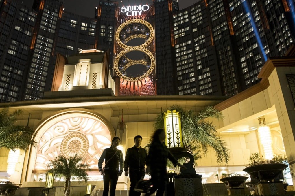People walk past Studio City casino resort in Macau, developed by Melco Crown Entertainment. Photo: Bloomberg