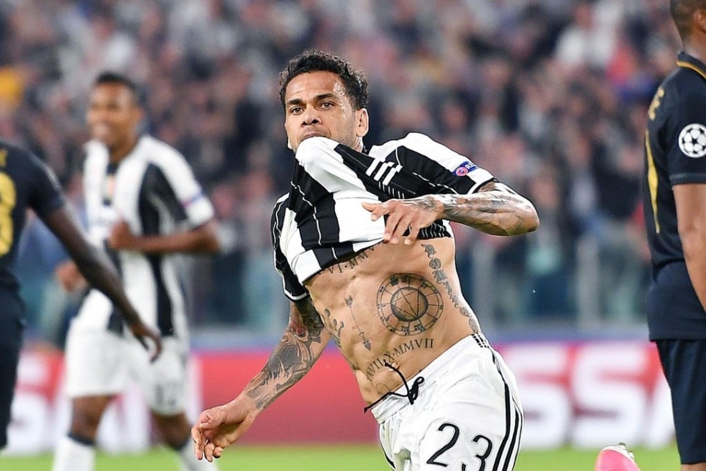Juventus defender Dani Alves celebrates after scoring his wonder goal against Monaco in the Champions League semi-final second leg in Turin. Photo: EPA