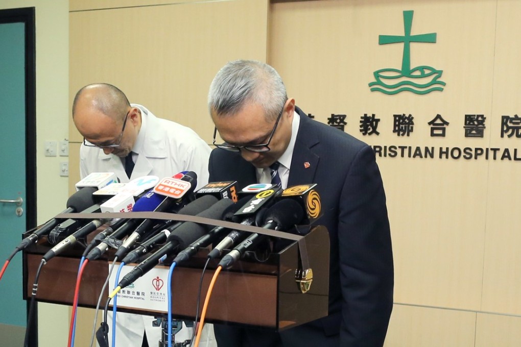 United Christian Hospital CEO Dr Chui Tak-yi (right) and Dr Kung Kam-ngai, chief of service in the department of medicine and geriatrics, bow in apology. Photo: Dickson Lee