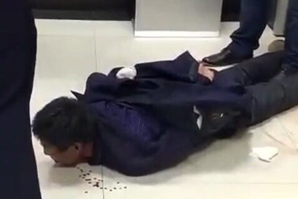 The suspect, said to be Wang Yunwei, is arrested after the stabbing spree at Changchun left 18 wounded. Photo: Handout.