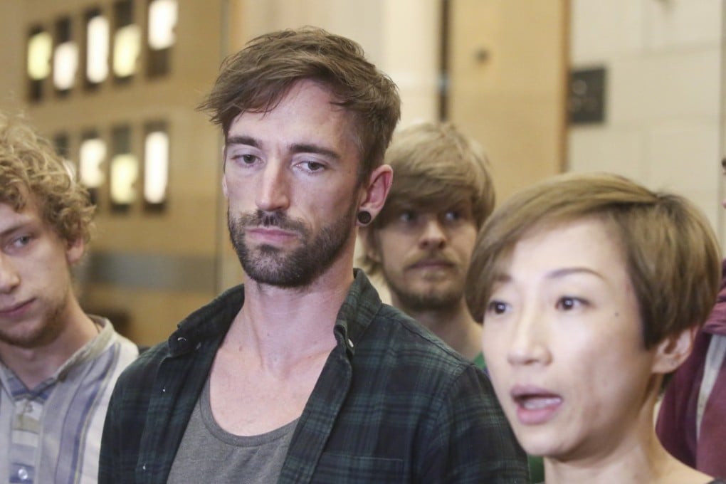 Musicians (from left) Henry Kohen, (Mylets), Chris Collis and Henry Tremain of TTNG, Hong Kong legislator Tanya Chan, and TTNG’s Tim Collis leaving the Immigration Department office in Kowloon Bay on Monday. Photo: Sam Tsang