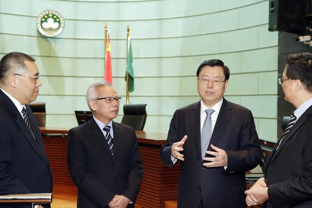 Zhang Dejiang (second from right) with Macau Chief Executive Fernando Chui (far left) during his unprecedented visit to the city’s Court of Final Appeal headquarters.Photo: GCS Macao