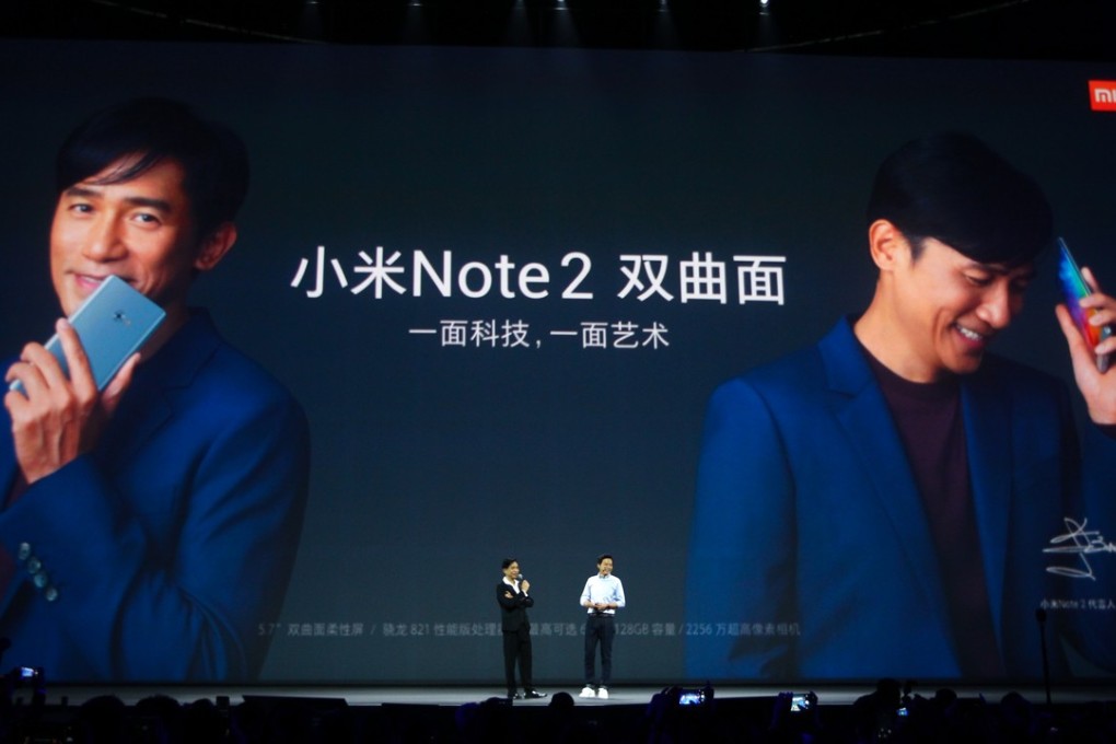 Hong Kong movie star Tony Leung Chiu-wai and Xiaomi founder and CEO Lei Jun present Xiaomi Mi Note 2 in Beijing last year. Leung is the representative of Xiaomi's latest Mi Note 2 smartphone. Photo: Simon Song
