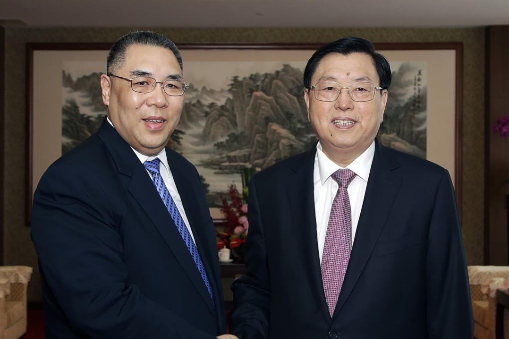 Macau Chief Executive Fernando Chui (left) welcomes the third-highest ranking Chinese official, Zhang Dejiang (right), to Macau on Monday. Photo: GCS