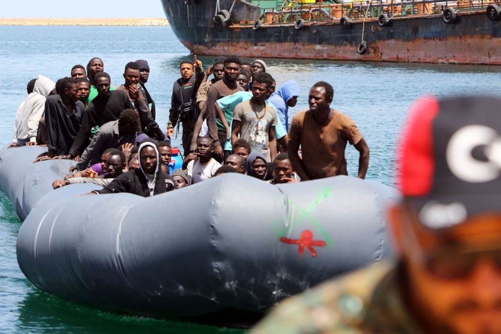 Migrants rescued by the Libyan coastguard in the Mediterranean Sea off the Libyan coast arrive at the naval base in the capital Tripoli on Saturday. Photo: AFP