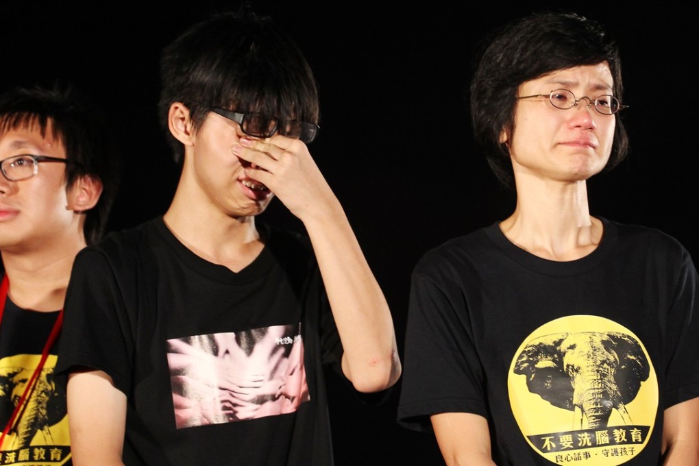 Joshua Wong (centre) protests against national education at a rally outside government headquarters, in Admiralty, in 2012. Picture: Felix Wong