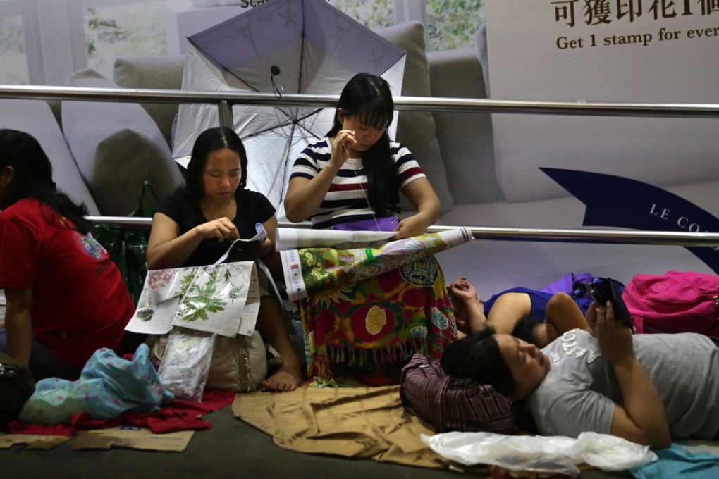 Domestic workers meet in Central on a day off in June last year. There are more than 300,000 migrant domestic workers employed in Hong Kong, a majority of them originating from Indonesia and the Philippines. Photo: AFP