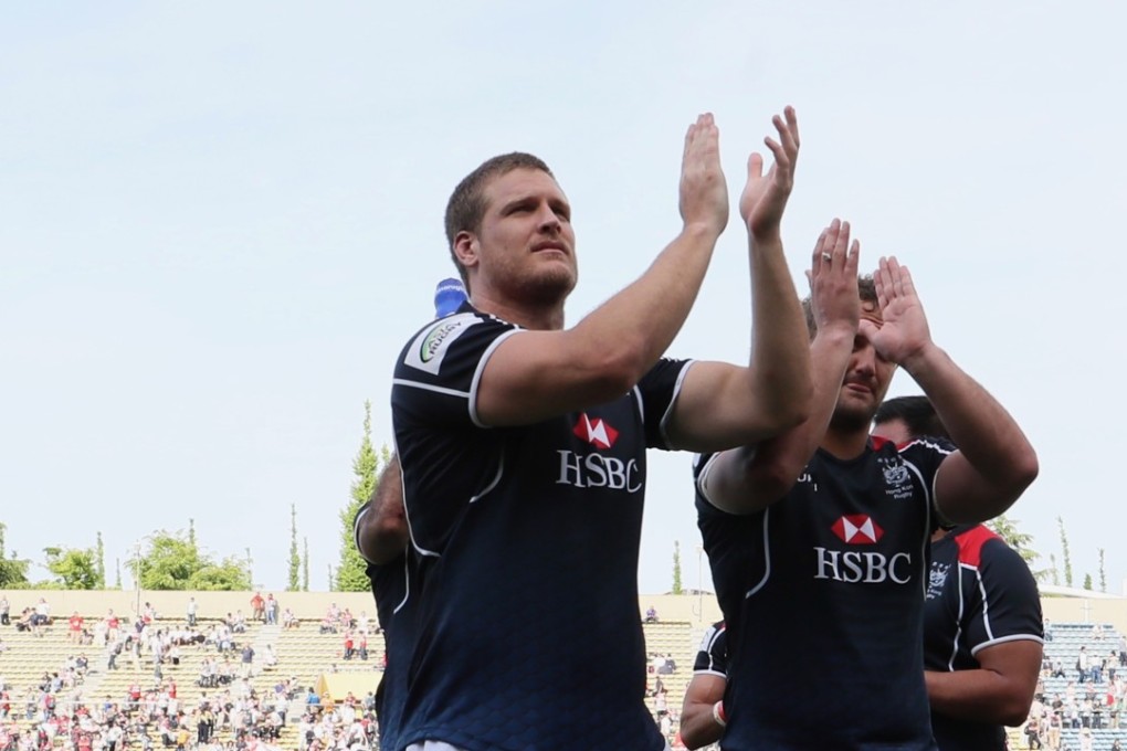 Dylan Rogers (centre) and his Hong Kong teammates acknowledge the crowd after their loss to Japan in Tokyo. Photos: Kenji Demura, Rugby Japan