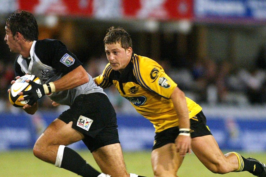 Jimmy Gopperth, right, chases Ruan Pienaar, left. in a 2005 match. Gopperth was named player of the year. Photo: AP