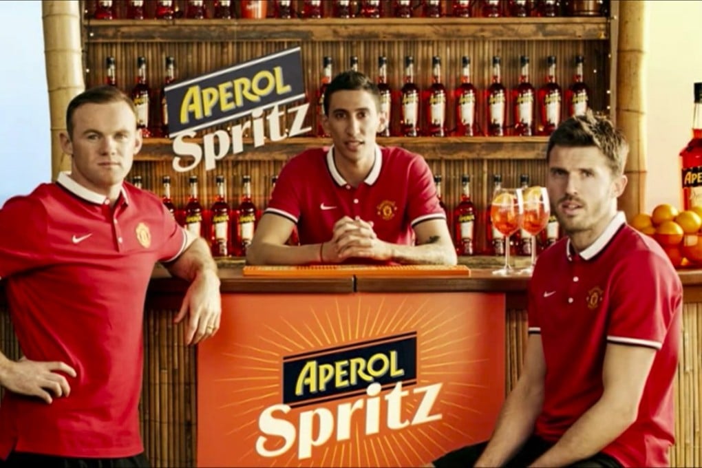 This screen grab from YouTube shows (from left) Wayne Rooney, Angel Di Maria and Michael Carrick in an Aperol Spritz advertisement.