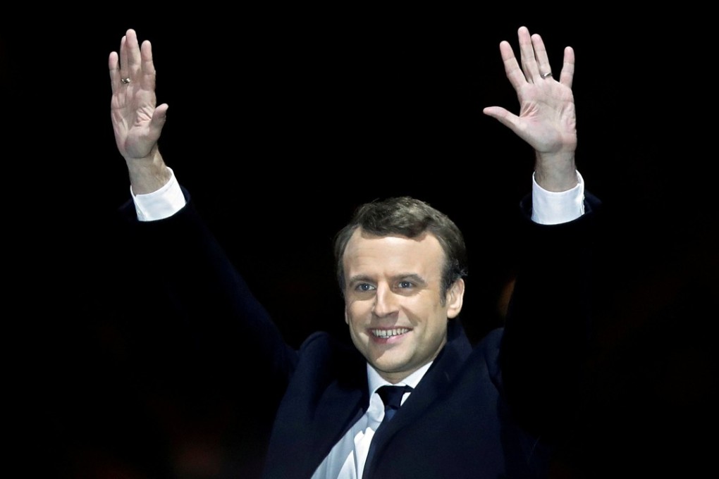 French President-elect Emmanuel Macron celebrates his election victory near the Louvre in Paris. Photo: Reuters
