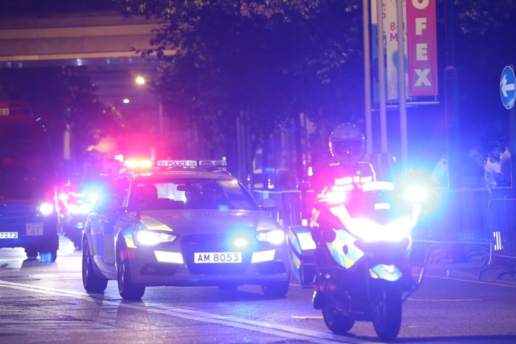 Police escorting cars arriving at the Grand Hyatt Hotel in Wan Chai. Photo: Dickson Lee