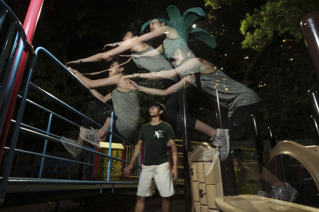 Jackie (top) practises parkour with Gon in Kowloon Park. Photo: Edward Wong