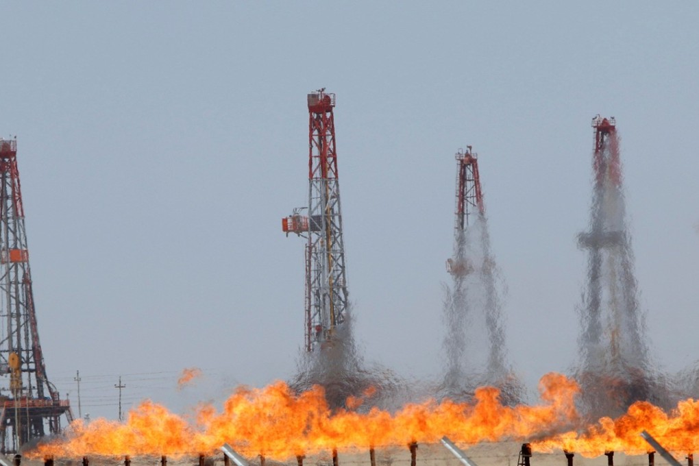 Flames emerge from a pipeline at Rumaila oilfield in Basra, Iraq, as oil prices extended a rally after US stocks fall sharply. Photo: Reuters
