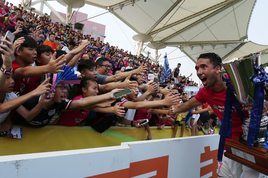 Kitchee’s Fernando Pedreira celebrates with fans after winning the Hong Kong Premier League. They will represent Hong Kong in the AFC Champions League next season. Photo: Jonathan Wong