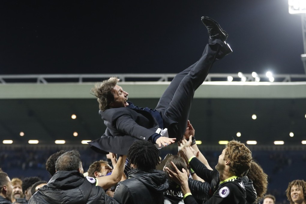 Chelsea manager Antonio Conte is thrown in the air by his players as they celebrate winning the Premier League title. Photo: Reuters