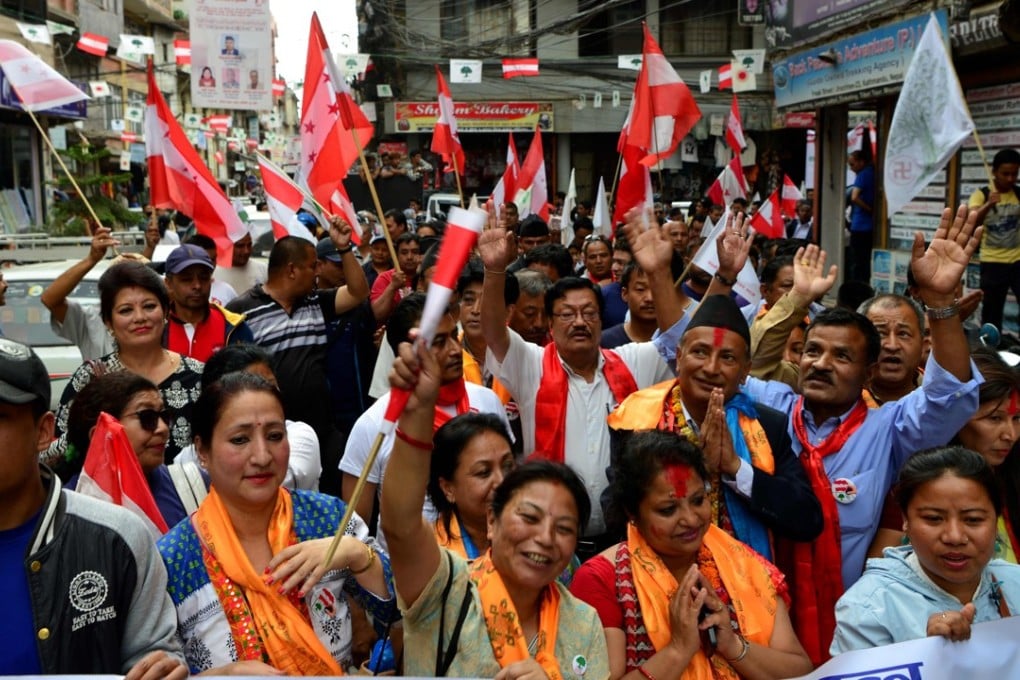 Nepalese activists parade with political party flags during campaigning in Kathmandu. Photo: AFP