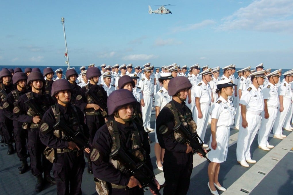 Naval officers and members of the special force unit of the Chinese Naval Third Escort Fleet take part in a ceremony in 2009 commemorating the end of an escort mission against pirates in the Gulf of Aden. Photo: Xinhua